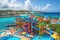 water park with vibrant and colorful slides, surrounded by blue waters