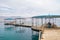 On water pavilions and wooden walkways with sitting inside tourists in famous Dolphins beach in Eilat, Israel