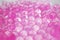 Water pink gel balls. Polymer gel. Silica gel. Balls of pink hydrogel.