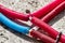 Water pipes corrugated in red and blue. Plumbing system in the floor. Pipe laying on the floor of the house