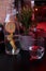 Water pitcher with lemons, a plant, and water glass at a restaurant in Kaunas, Lithuania