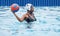 Water polo, woman and ball in pool for game, training or competition with fitness, vision or goal. African athlete