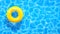 Water pool summer background with yellow pool float ring. Summer blue aqua textured background