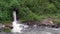 Water pouring rapidly out of drainage culvert