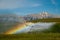 Water rainbow efect around spraying machine, Southern Alberta, Canada