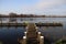 Water with reed strips and wooden piers on the Rottemeren