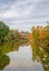 Water refection of autumn trees on a canal in Kyoto