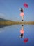 Water Reflection Happy Woman Jumping with blue sky