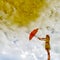 Water reflection and red umbrella woman