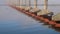 water reflections of a bridge over Tennessee River from Tennessee to Alabama, foggy November sunrise