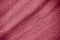 Water-repellent fabric in large raindrops. Burgundy rip-stop fabric. Tent textiles.