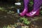 Water-resistant rubber boots in rain, flood and gardening