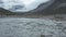 Water Rippling Over Rocks Near Mountains