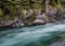 Water Rushes Past Boulders above McDonald Falls