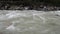 Water rushing in a Himalayan river near the Annapurna range. Nepal