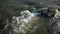 Water rushing by a rock in a river forming a smooth at Leh Ladakh India closeup shot