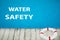 Water safety. Life buoy near swimming pool with clean water