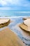 Water and sand on the shoreline in Follonica, Italy