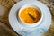 Water Shield Soup with Mushroom,Crab Cream and Fish served in a bowl