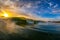 Water shot of a wave breaking in the sunrise at Campeche beach in FlorianÃ³polis Brazil