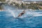 Water skis glides on the waves, female athlete on Aegean Sea, Greece