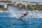 Water skis glides on the waves, female athlete on Aegean Sea, Greece