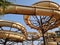 Water slide of a beige water park on a sunny day with blue sky