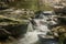 Water from small stream cascading over rocks