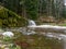 Water in small stream, water in motion in autumn forest