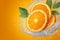 Water splashes on fresh orange slices, creating dynamic scene