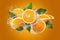 Water splashes on fresh orange slices, creating dynamic scene