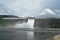 Water splashing from floodgate Khun Dan Prakarn Chon huge concrete dam in Thailand