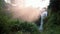 Water spray and mist rising from Tegenungan Waterfall, Ubud, Bali - no people, morning