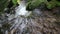 Water stream flowing among stones