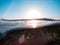 Water surface and coastline at sunset.