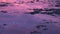 Water surface and reflection purple sunset over sea on islands of Philippines.