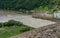 Water surging through spillway after torrential rains