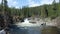 Water swirling at the bottom of a cascade in the rocky mountains