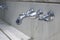 Water tap, Chrome faucet with white marble sinks. Hygiene concept