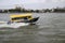 Water taxi with high speed on the river Nieuwe Maas in Rotterdam as fast transport way