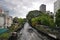 A water taxi passing by Phanfa Bridge Water Gate river in Bangkok, Thailand