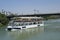 Water taxi. River taxi boat, Puente de Triana, Triana Bridge, The Guadalquivir River in Seville, Andalusia, Spain, Europe