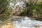 The water  threshold for the swift, shallow, cold mountain Ayun river in the Galilee in northern Israel