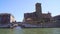 Water tour in Venice, boat sailing on Grand Canal, view on buildings and bridge