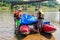 Water tourists in the process of assembling catamarans