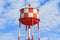 Water tower with red and white stripes