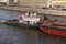 Water transport. River boat tow pusher in the canals of the Moscow river against the backdrop of the capital of Russia