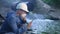 water treatment engineer examines environmental pollution. biologist with digital tablet examines water allergy. worker