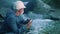 water treatment sun engineer examines environmental pollution. biologist with digital tablet examines water allergy