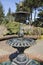 Water trickling over a fountain on a sunny day at Shore Acres State Park, Oregon